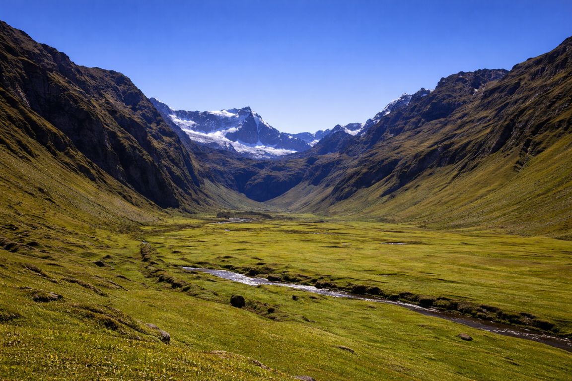 Scenic Collanes Valley landscape beneath El Altar volcano captured during El Altar Ecuador Tours