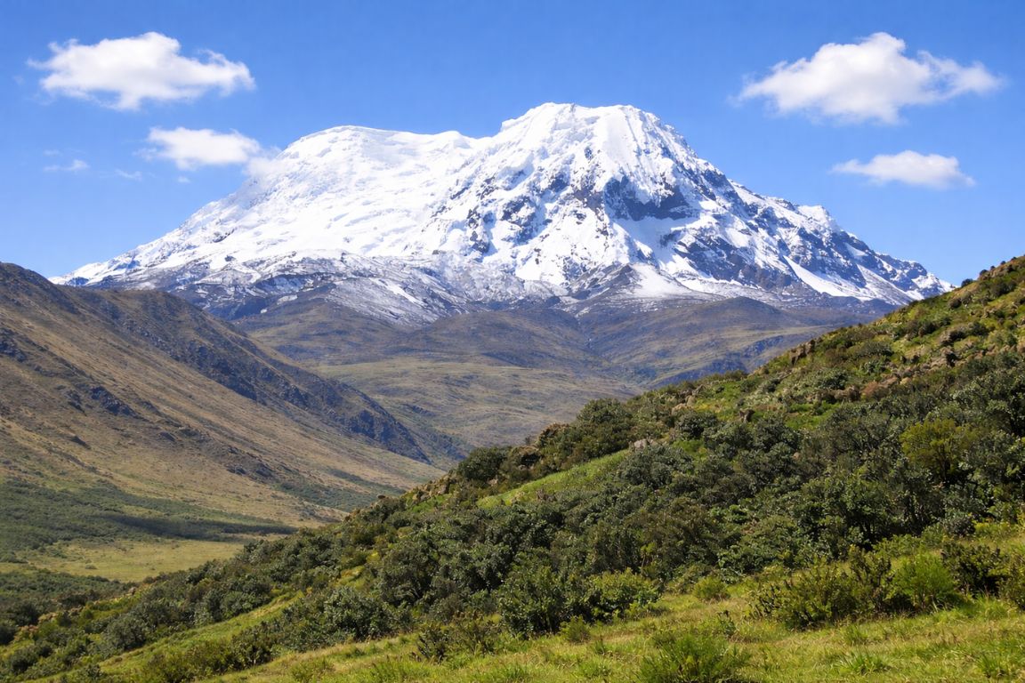 Snow-capped Antisana Volcano rising above Andean valley during El Altar Ecuador Tours expedition